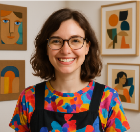 A smiling person with glasses
