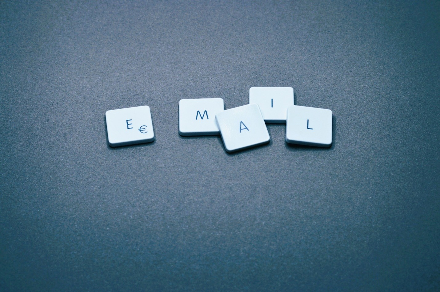 letter tiles spell out the word email